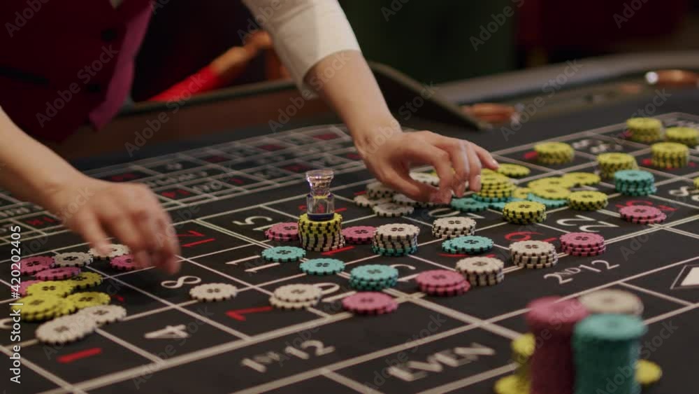 Croupier takes chips off table Croupier takes chips off table