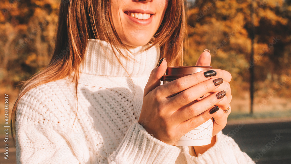Cheerful drinking coffee. Happy young girl with cup of tea in sunshine light enjoying her morning coffee. Beautiful woman lifestyle. Cheerful drinking coffee. Happy young girl with cup of tea in sunshine light enjoying her morning coffee. Beautiful woman lifestyle.
