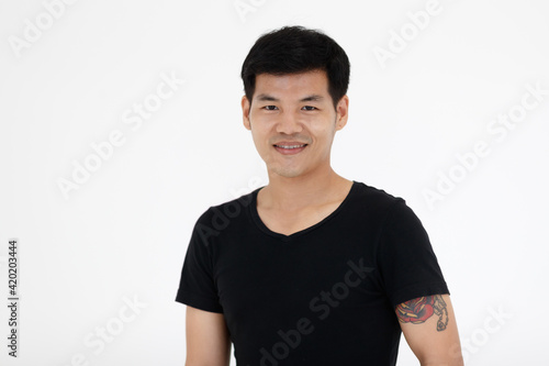 Portrait of young Asian teen man in casual clothing t-shirt on white background