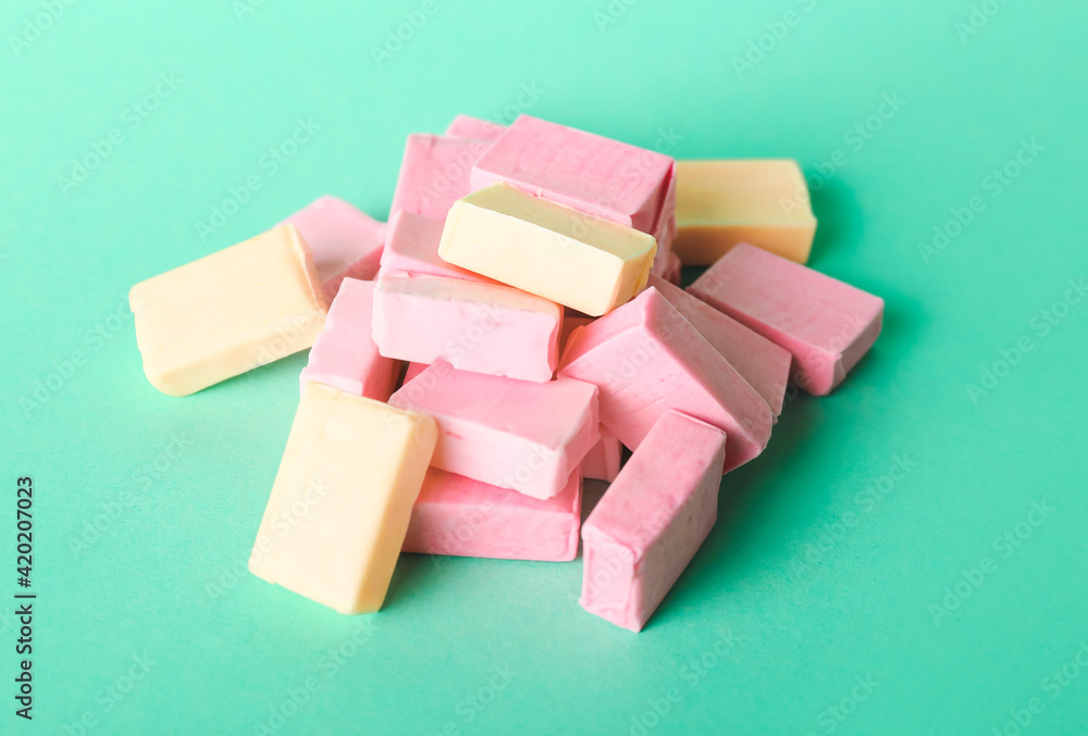 Tasty chewing gums on color background Tasty chewing gums on color background