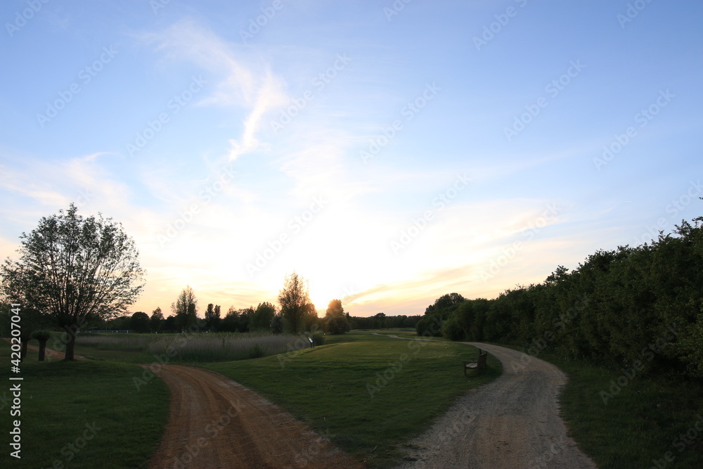 Golfcourse with beautiful sky and lights with green grass Golfcourse with beautiful sky and lights with green grass