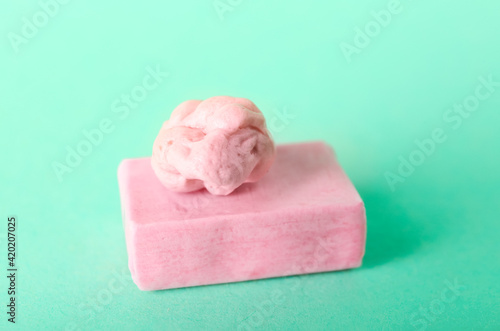 Tasty chewing gum on color background