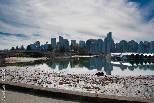 Skyline of the downtown and the symmetry reflection on the low tide lagoon.     Vancouver BC Canada   