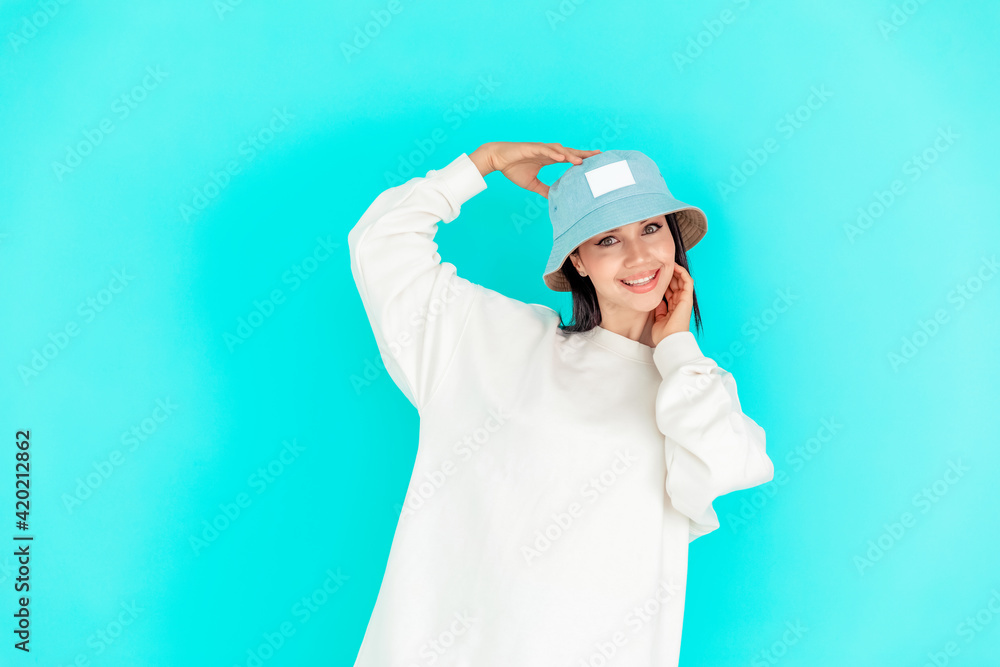 portrait of a beautiful girl in a denim cap