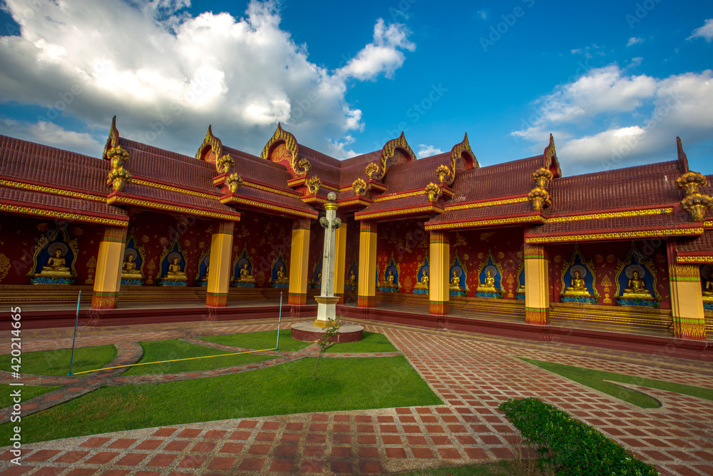 Naklejka premium The beautiful sculpture background of, Wat Bang Thong, surrounded by trees, has a large area, is a religious tourist attraction in Krabi, with tourists always visiting, Thailand