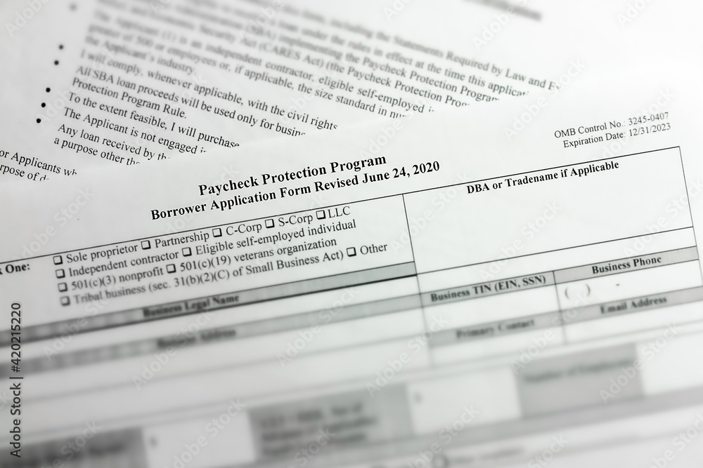 Obraz premium selective focus photo of paycheck protection program borrower application form revised. paycheck protection program new round