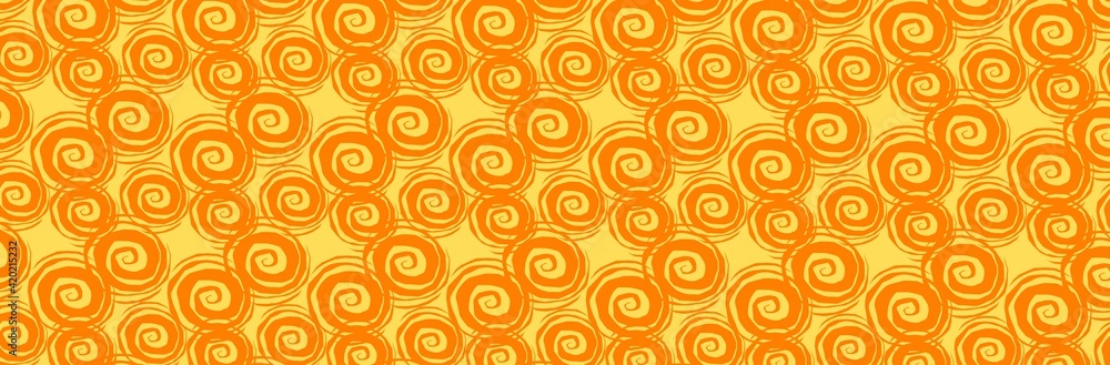 Orange spirals evenly spaced against a yellow background in a panoramic view Orange spirals evenly spaced against a yellow background in a panoramic view