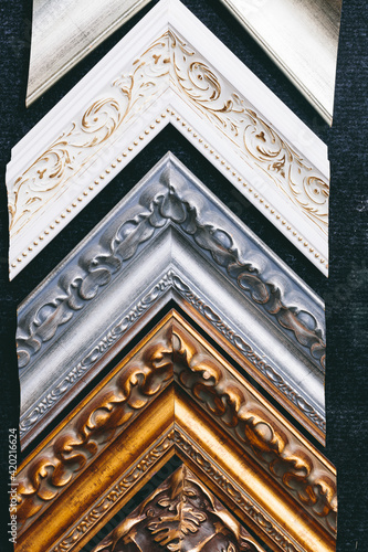 Wooden picture frames on wall in a store, background