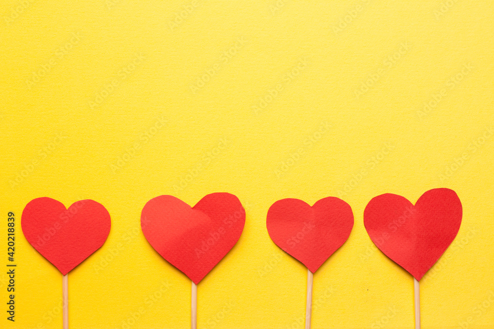 red heart valentine gift holiday romance yellow background