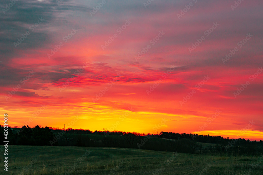 Sunrise over rural landscape