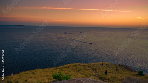 The background of the sea by the evening sea  with natural beauty  sea water  rocks  sky  and fishermen are fishing by the river bank  is a pleasure during travel.
