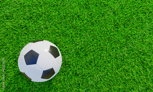 Realistic soccer ball or football ball basic pattern on green grass field. 3d Style and rendering concept for game. Use for background or wallpaper.