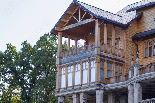Huge beautiful wooden house with a balcony and large windows