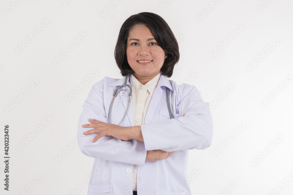 Smiled kindness asian female doctor standing isolated on white background. Smiled kindness asian female doctor standing isolated on white background.