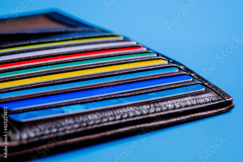 Wallpaper Mural Wallet with plastic credit cards on blue background. Banking and finance concept Torontodigital.ca