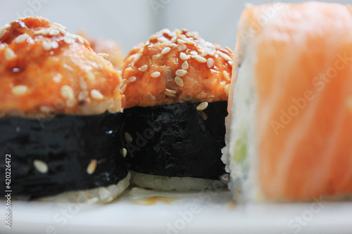 Sushi rolls baked food. Japanese traditional sushi close up