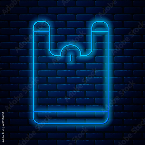 Glowing neon line Plastic bag icon isolated on brick wall background. Disposable cellophane and polythene package prohibition sign. Vector