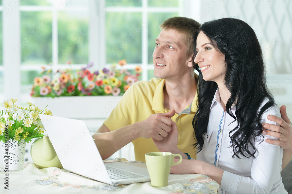 Portrait of happy young couple with laptop Portrait of happy young couple with laptop