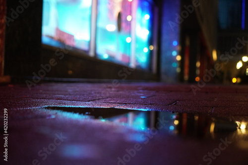 Purple light street puddle