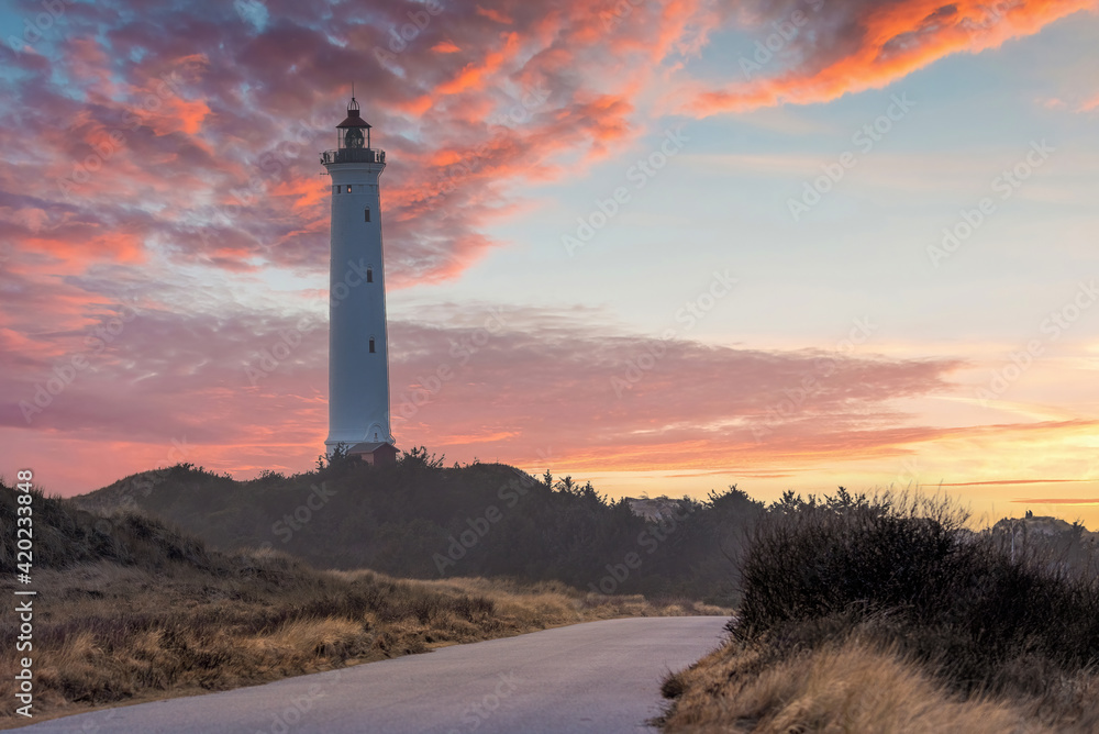 Built in 1906, the 38 meter tall Lyngvig Fyr Lighthouse on the Danish North Sea coast serves as a beautiful tourist attraction amongst the Danish Sand Dunes.	