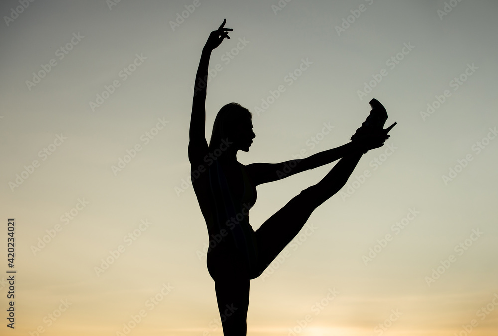 ballet dance position. woman dance in dark. dark figure shape. girl dancing in dusk
