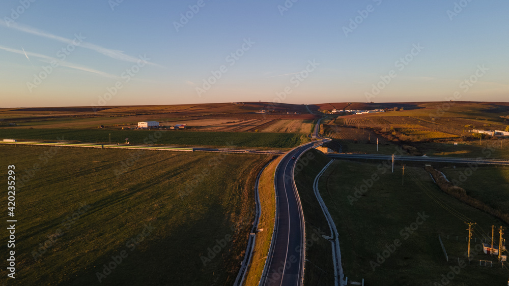 Drone image of a highway on a sunset