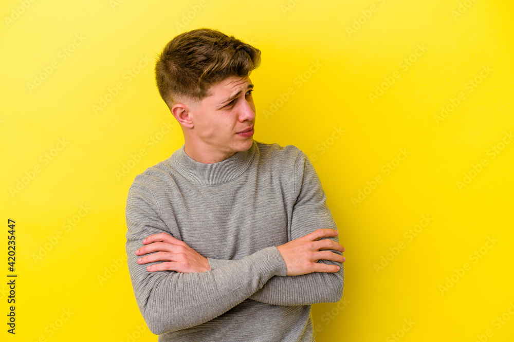 Young caucasian man isolated on yellow background dreaming of achieving goals and purposes Young caucasian man isolated on yellow background dreaming of achieving goals and purposes