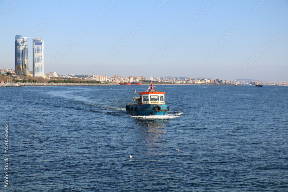 selective focus. the sea of ​​marmara, fishing boats fishing off the coast of Büyükada.