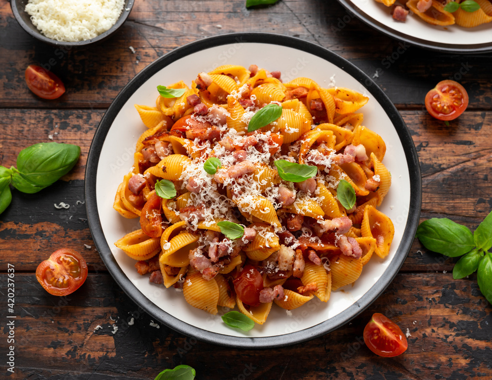 Conchiglie alla Amatriciana pasta with pancetta bacon, tomatoes and pecorino cheese. Healthy Italian food Conchiglie alla Amatriciana pasta with pancetta bacon, tomatoes and pecorino cheese. Healthy Italian food