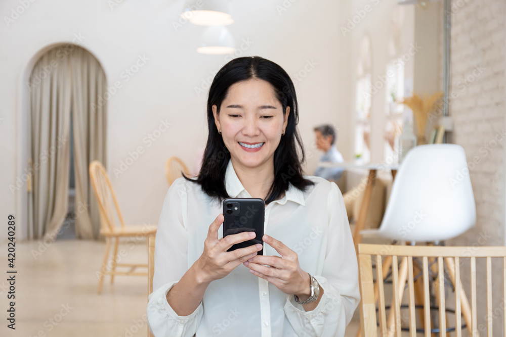 woman using cell phone hand holding mobile texting message contact us.chatting,search internet information in office.technology device communication connecting woman using cell phone hand holding mobile texting message contact us.chatting,search internet information in office.technology device communication connecting