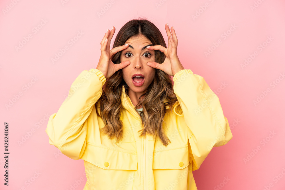 Young caucasian woman isolated keeping eyes opened to find a success opportunity. Young caucasian woman isolated keeping eyes opened to find a success opportunity.