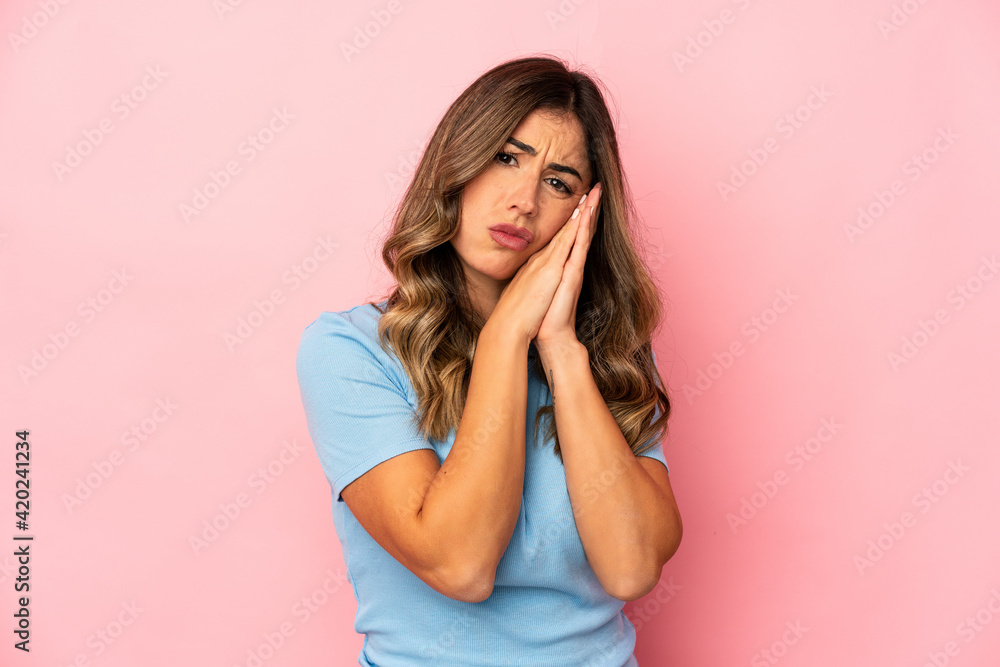 Young caucasian woman isolated yawning showing a tired gesture covering mouth with hand. Young caucasian woman isolated yawning showing a tired gesture covering mouth with hand.