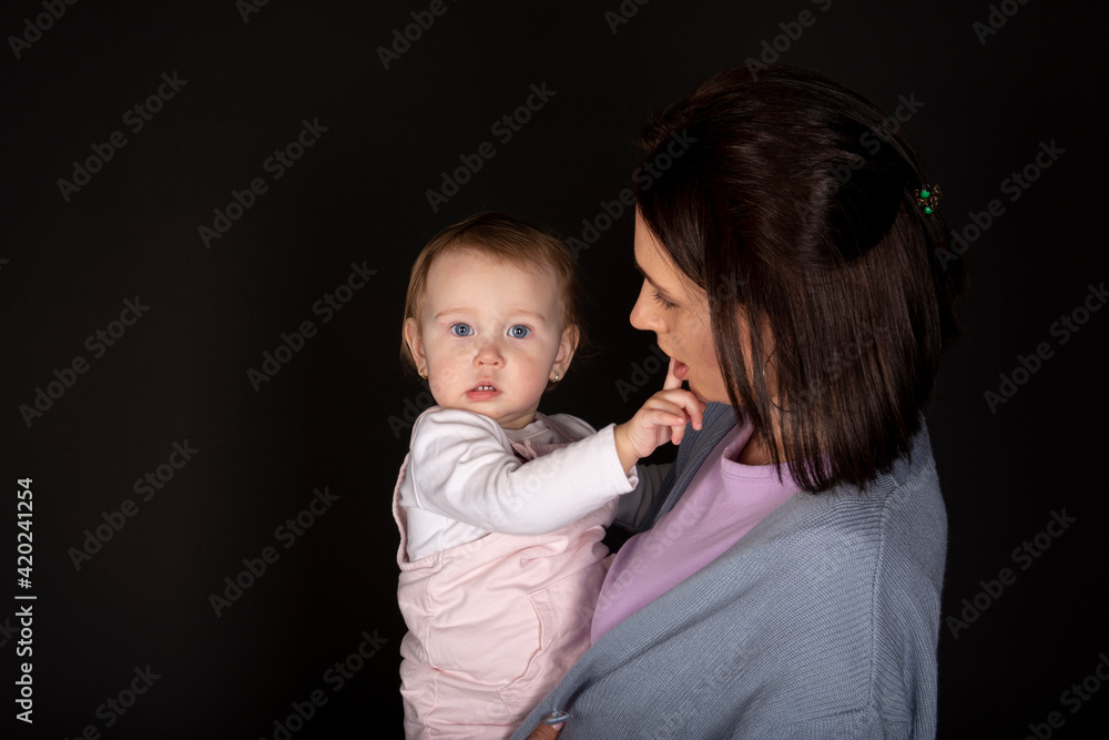 Beautiful young mother with her cute and happy daughter Beautiful young mother with her cute and happy daughter