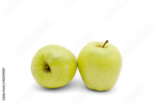 Ripe Juicy golden delicious apples isolated on a white background