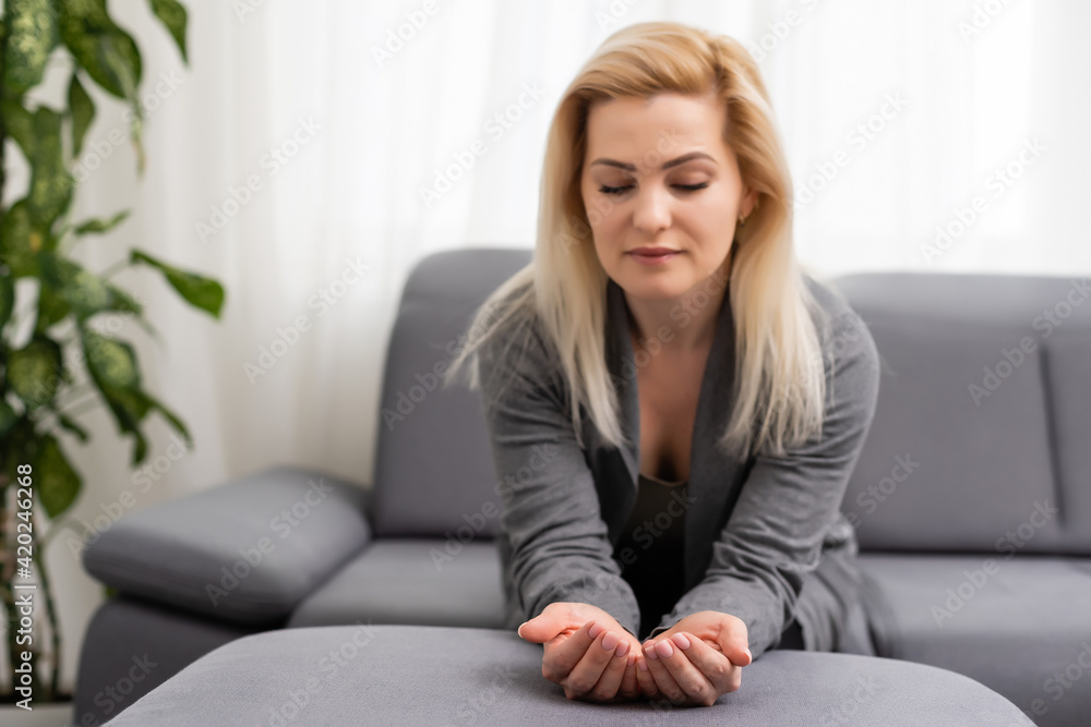 beautiful woman showing something on the palm of her hand beautiful woman showing something on the palm of her hand