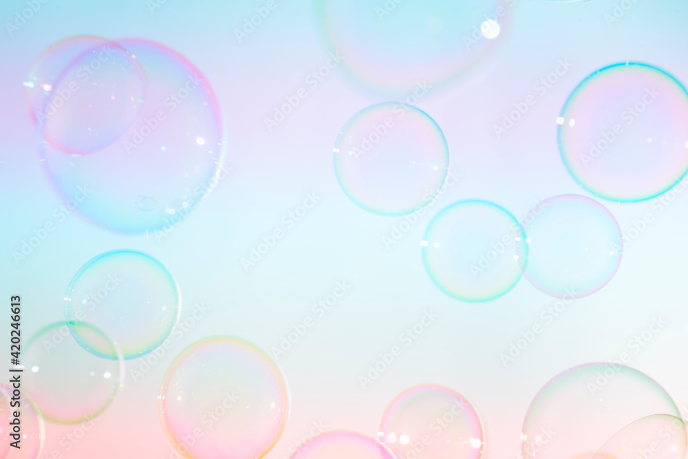 Beautiful transparent colorful soap bubbles floating background.