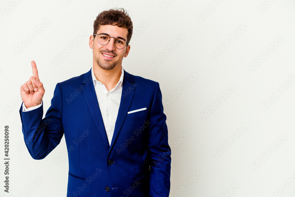 Young business caucasian man isolated on white background showing number one with finger. Young business caucasian man isolated on white background showing number one with finger.