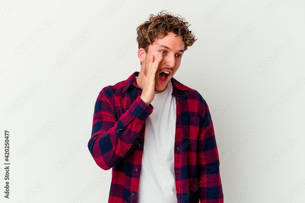 Young caucasian man isolated on white background shouting excited to front. Young caucasian man isolated on white background shouting excited to front.