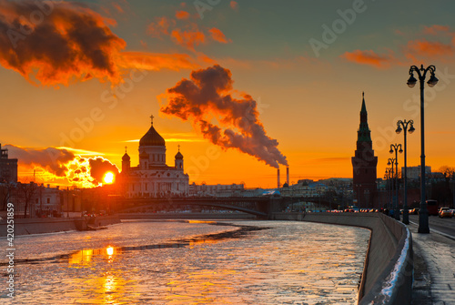 Building of the Cathedral of Christ the Saviour, Kremlin tower and Moskva river. Winter sunset. Moscow. Russia