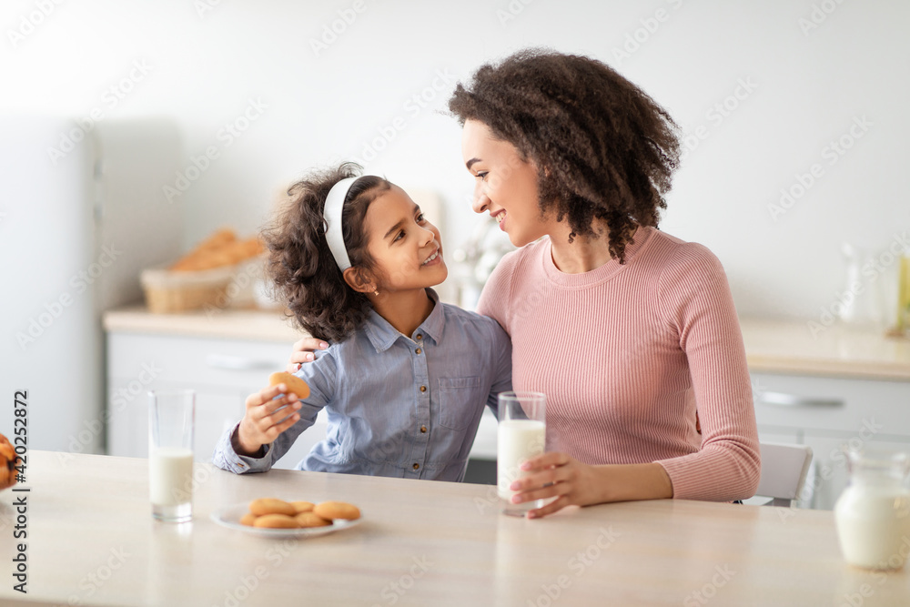 Cute Little Afro Girl And Woman Drinking Milk Cute Little Afro Girl And Woman Drinking Milk