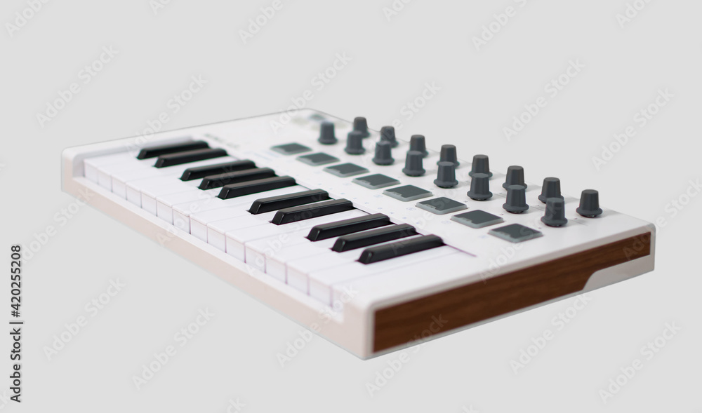 Fototapeta premium White midi keyboard with knobs and pads