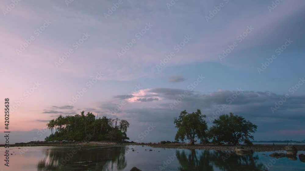 4K. 4096x2304p. 24 FPS. Nature video Time lapse landscape view of sunset in sea. Rock beach and Island or mountain in sea. Golden sky sunset or sunrise 4K. 4096x2304p. 24 FPS. Nature video Time lapse landscape view of sunset in sea. Rock beach and Island or mountain in sea. Golden sky sunset or sunrise