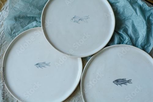 Handmade ceramic craft ware. Plate. photo