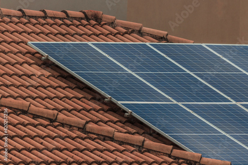 Solar photovotaic panel at a roof at suset. Solar energy house company concept image. Space for text