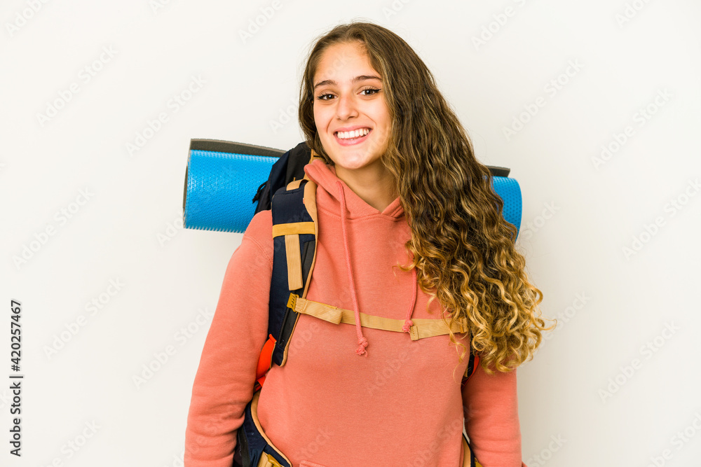 Young caucasian woman ready for a trip isolated happy, smiling and cheerful. Young caucasian woman ready for a trip isolated happy, smiling and cheerful.