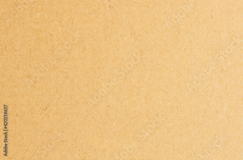 Paper brown texture light rough textured spotted blank copy space background in yellow