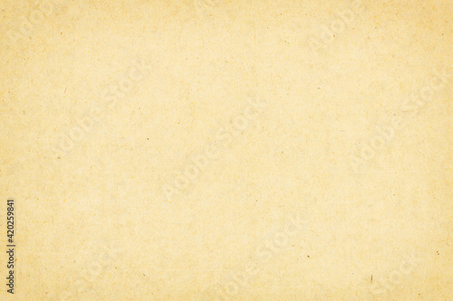 Paper texture light rough textured spotted blank copy space background in beige, yellow, brown