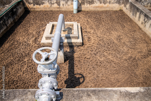 Wallpaper Mural Sludge drying bed in waste-water treatment plant system, brown sand in unplanted drying bed. Waste management facility. Torontodigital.ca