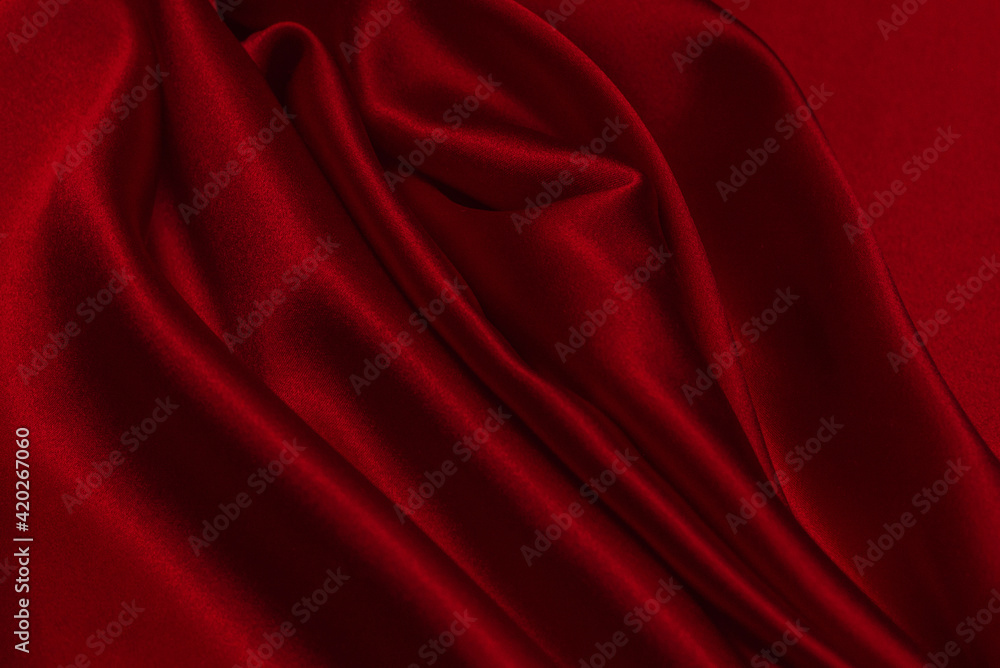 Red silk or satin luxury fabric texture can use as abstract background. Red silk or satin luxury fabric texture can use as abstract background.