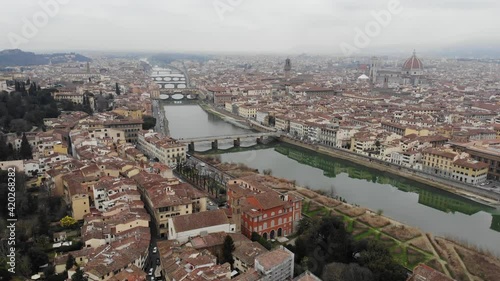 Wallpaper Mural Opening panorama from a drone to Santa Trinita. A bridge over the Arno river in Florence from a drone. The oldest arched bridge with elliptical spans. Cathedral of Santa Maria del Fiore. Torontodigital.ca
